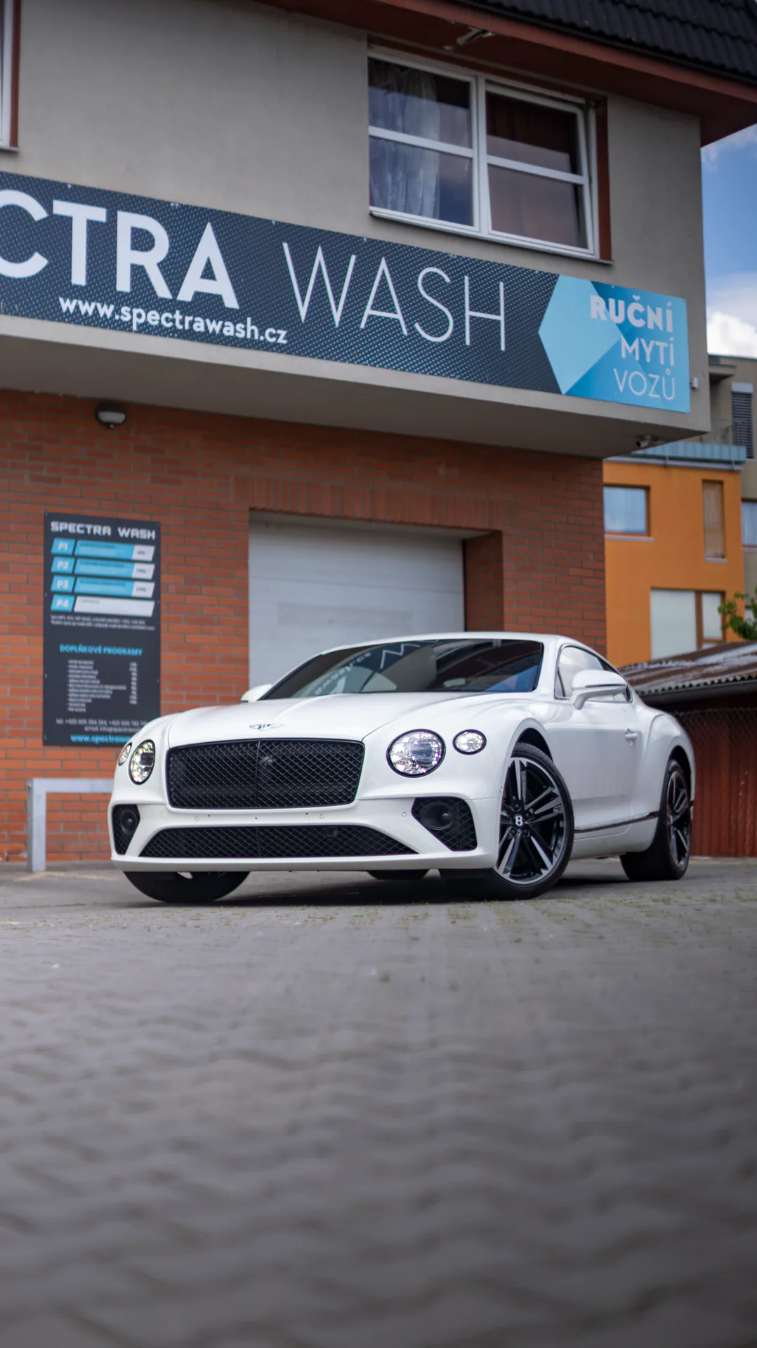 A white Bentley outside Spectra Wash